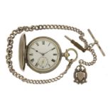 Gentlemen's silver full hunter pocket watch on a graduated silver watch chain with T bar and