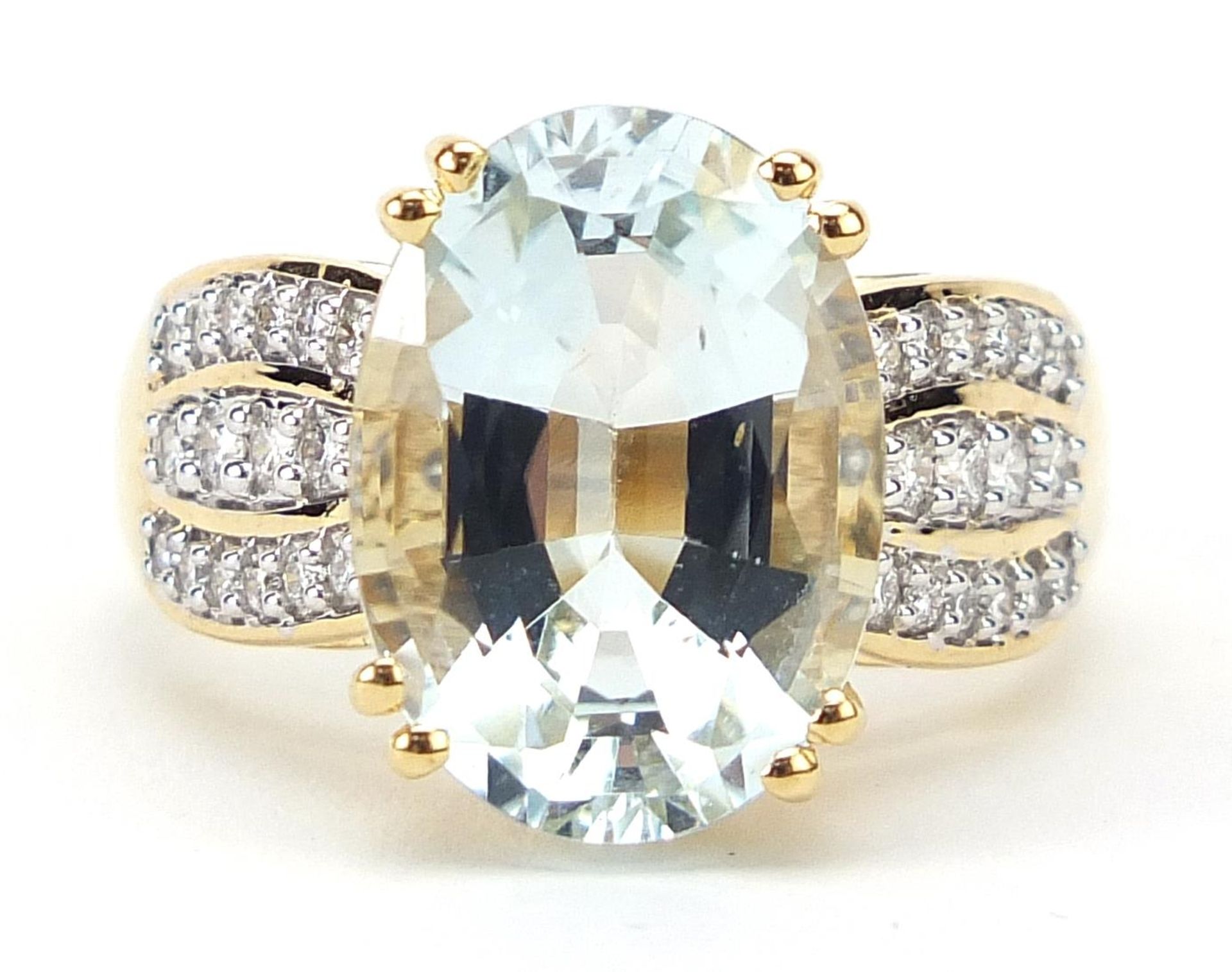 Lorique, 18ct gold aquamarine and diamond ring, the aquamarine approximately 6.2ct, size N, 7.7g