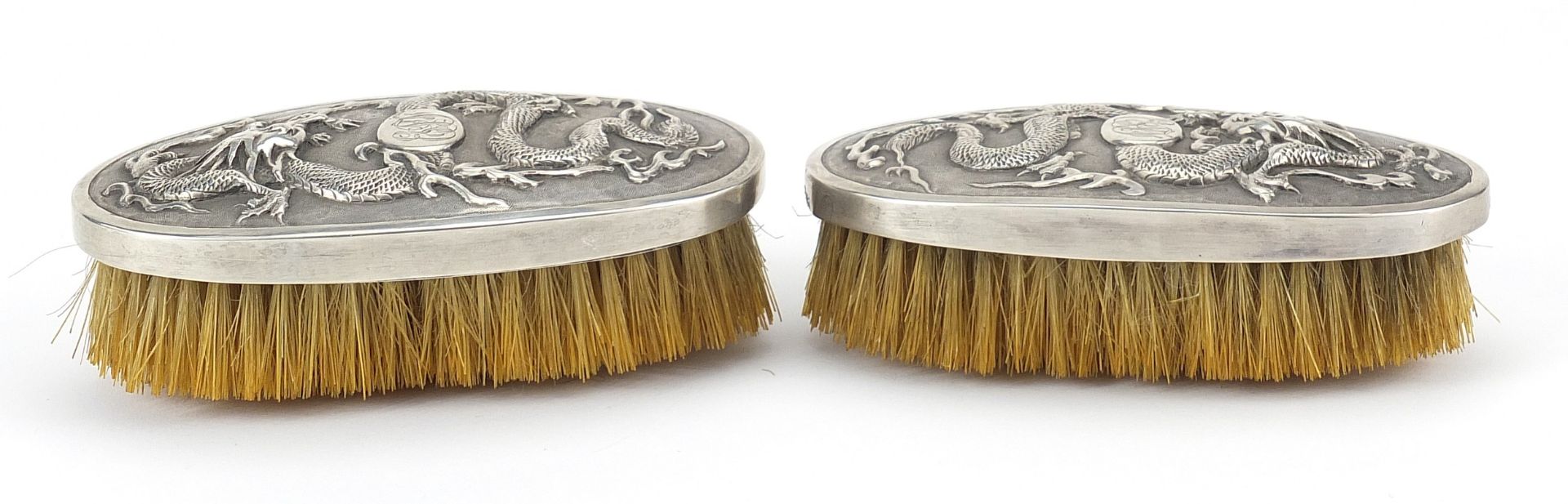 Pair of Chinese silver backed brushes embossed with dragons by Woshing, 13cm wide - Image 3 of 5