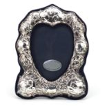 Art Nouveau design silver easel photo frame embossed with Putti and stylised flowers, R.B.B,