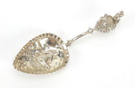 Antique Dutch silver caddy spoon, the bowl embossed with a lady farmer and cattle, indistinct