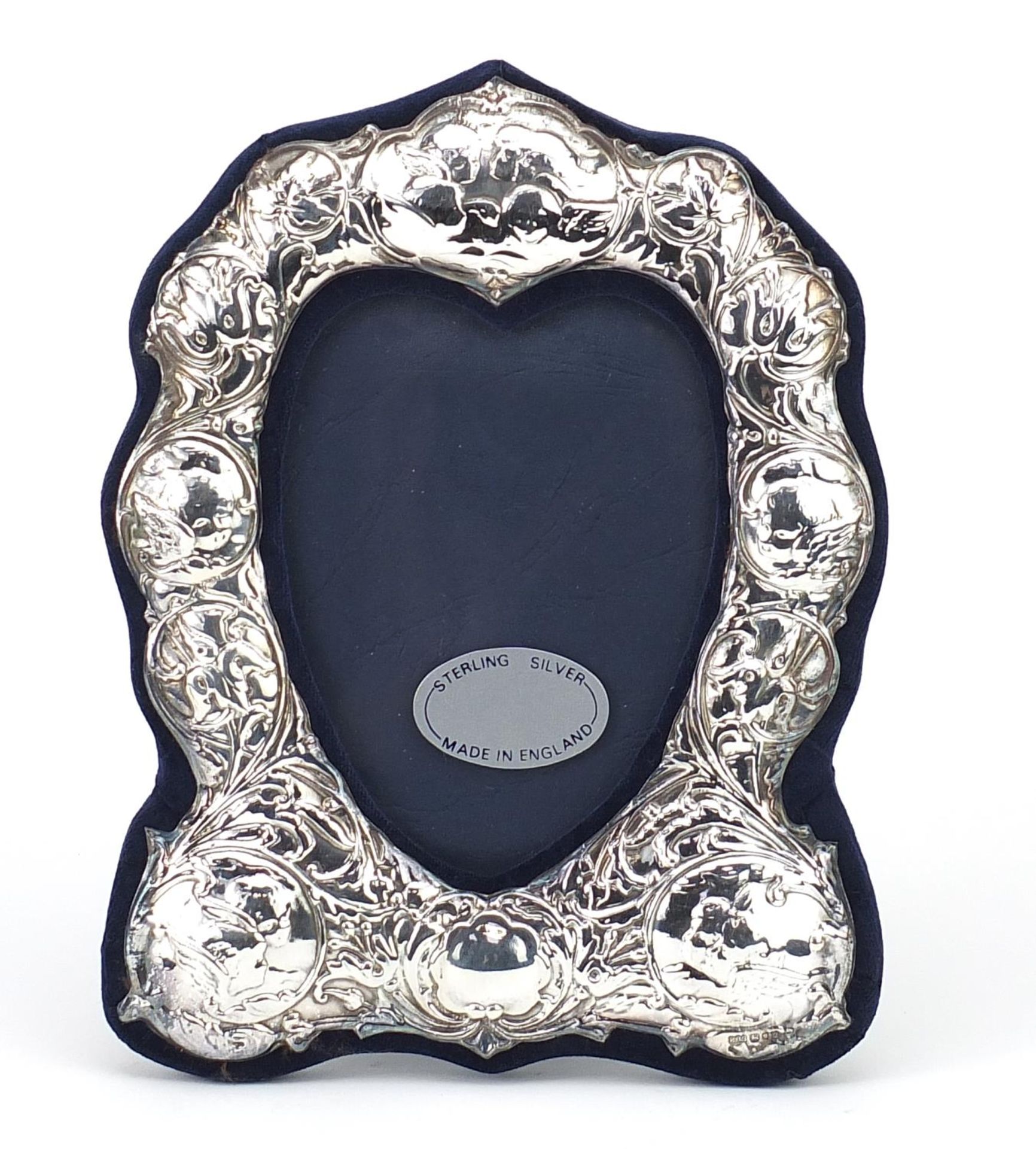 Art Nouveau design silver easel photo frame embossed with Putti and stylised flowers, R.B.B,