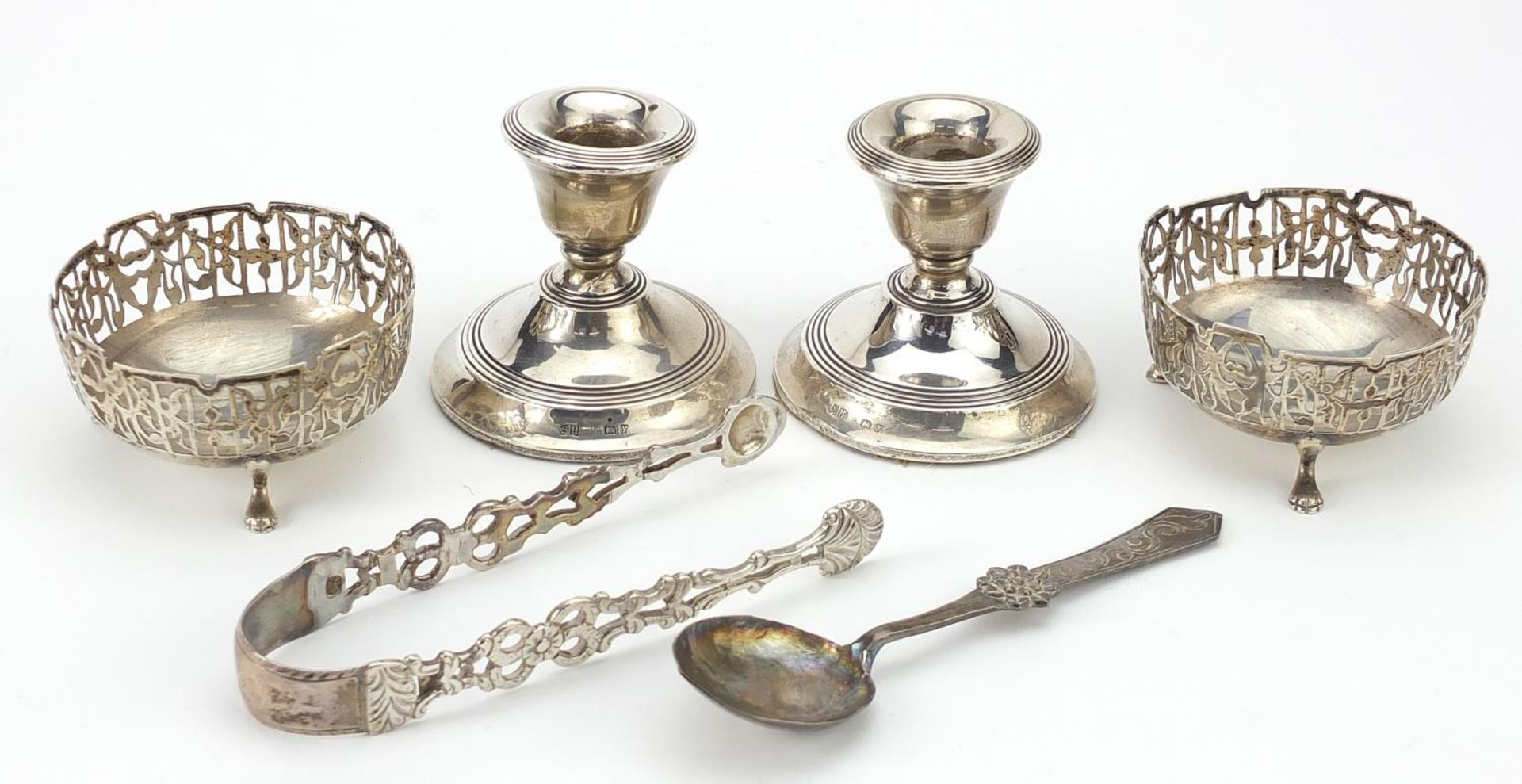 Silver objects comprising pair of dwarf candlesticks, pair of open salts, sugar tongs and a spoon, - Image 4 of 5