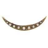 Antique unmarked high carat gold pearl and diamond moon crest brooch, 5.5cm wide, 4.7g