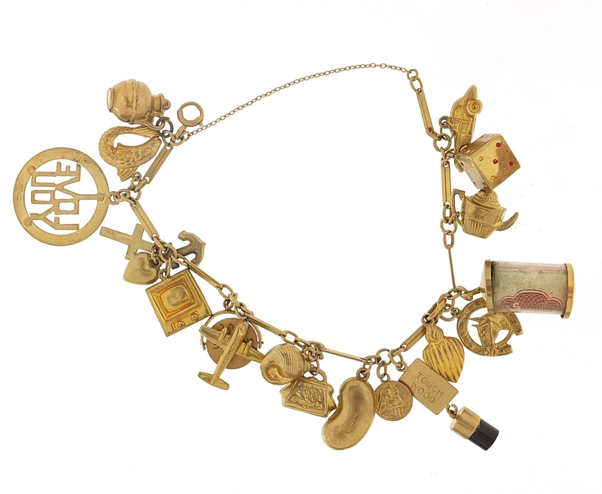 9ct gold charm bracelet with a selection of mostly 9ct gold charms including emergency ten