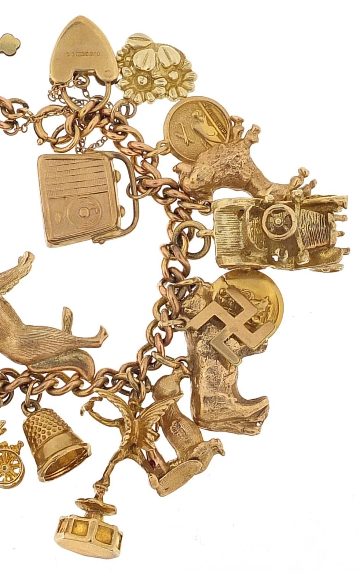 9ct gold charm bracelet with a large selection of mostly 9ct gold charms including Alsatian dog, - Image 3 of 7