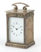 Tongue & Walker, George V silver cased carriage clock with enamelled dial and swing handle,