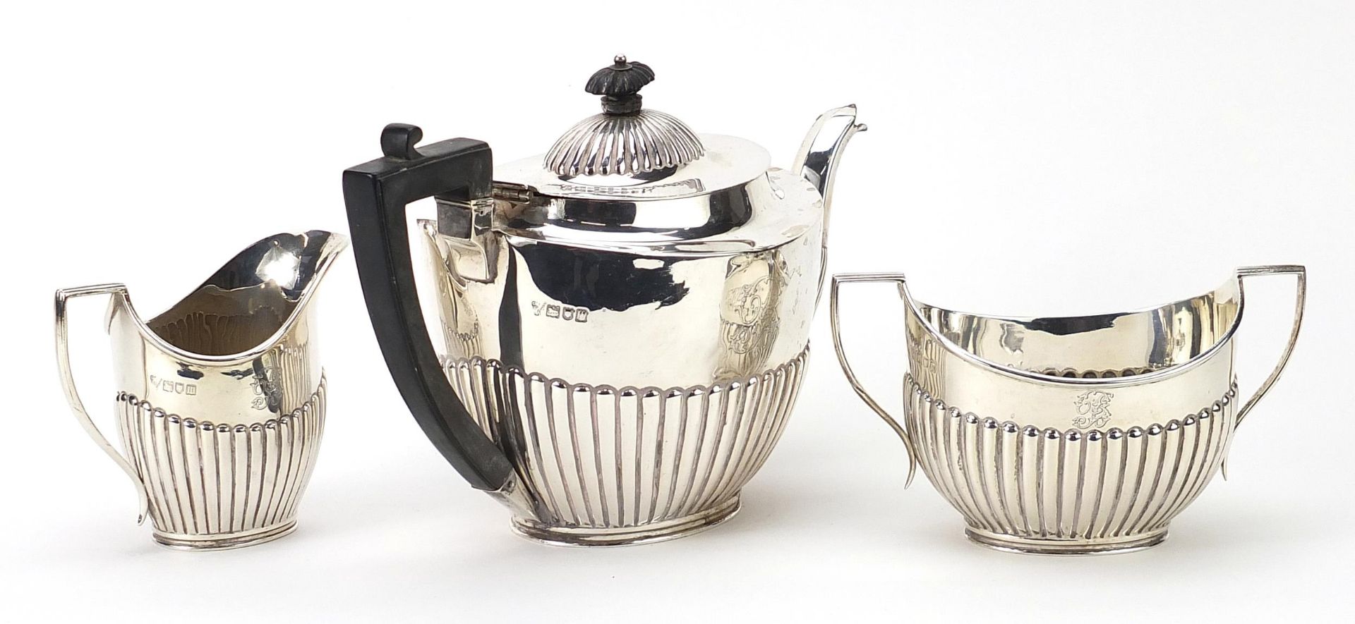 C S Harris & Sons Ltd, Edwardian matched silver three piece demi fluted tea service retailed by - Image 2 of 5