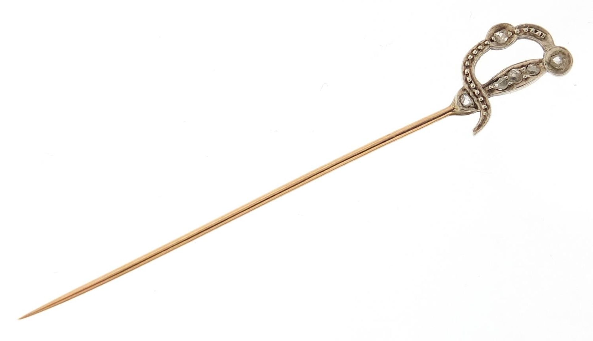 Antique unmarked gold diamond stick pin in the form of a sword, 6.5cm in length, 1.3g