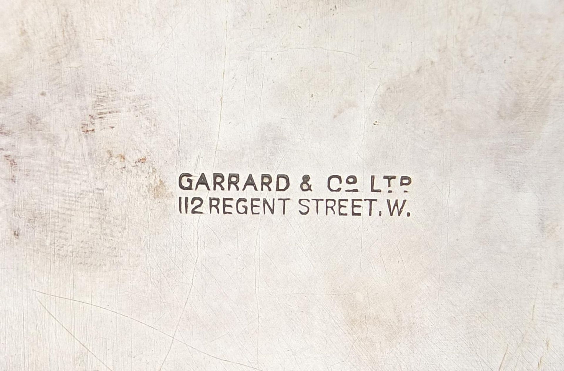 Garrard & Co Ltd, circular silver salver with Celtic design border and raised on three feet, - Image 4 of 5