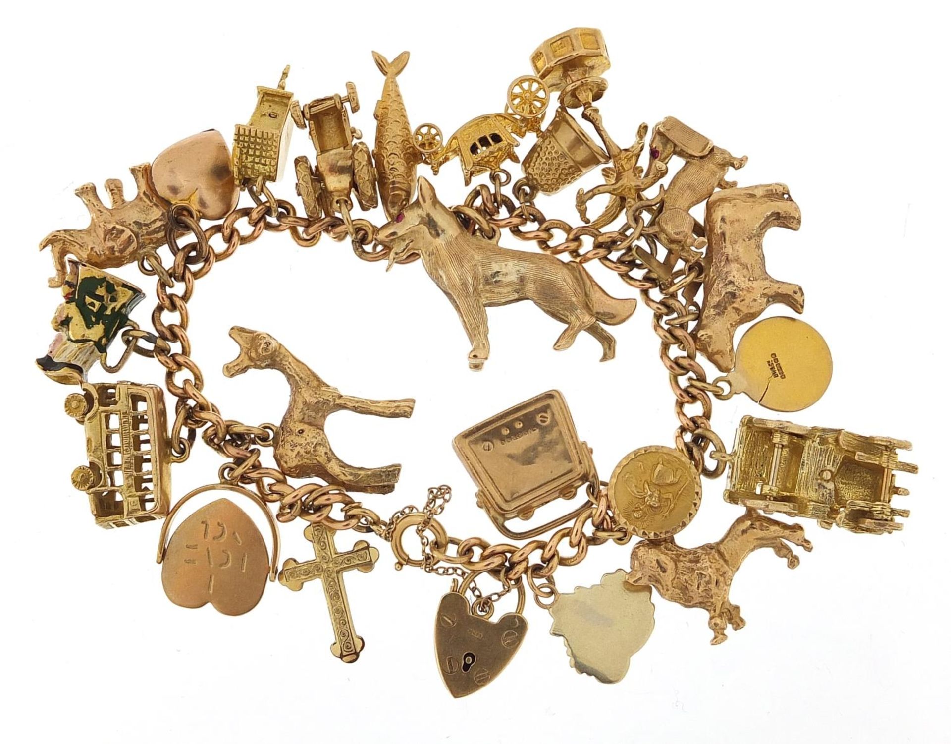 9ct gold charm bracelet with a large selection of mostly 9ct gold charms including Alsatian dog, - Image 4 of 7