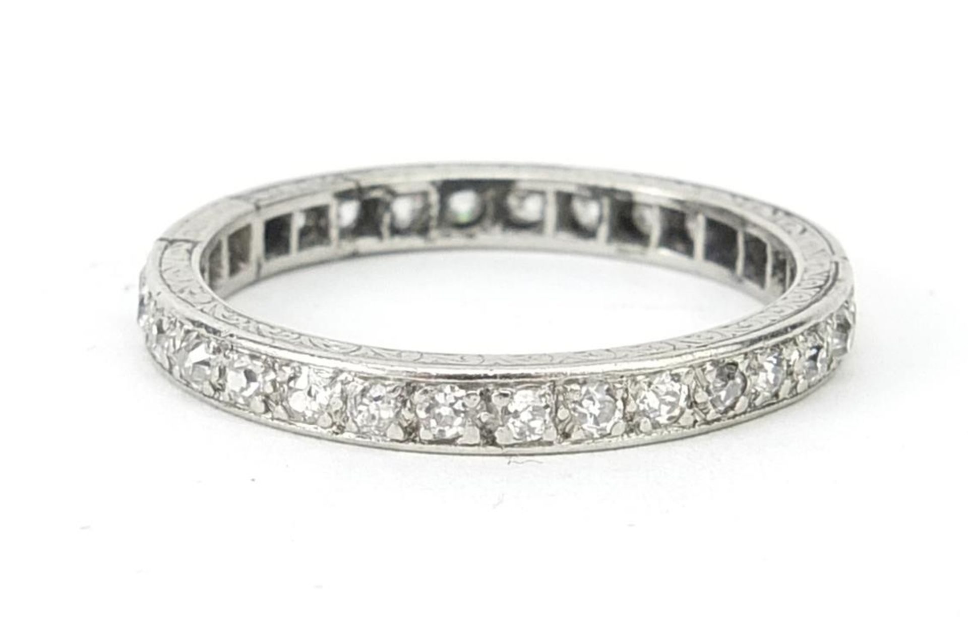 Unmarked white metal diamond eternity ring, the diamonds approximately 1.5mm in diameter, size S,