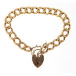 9ct gold curb link bracelet with love heart padlock, 22cm in length, 15.2g