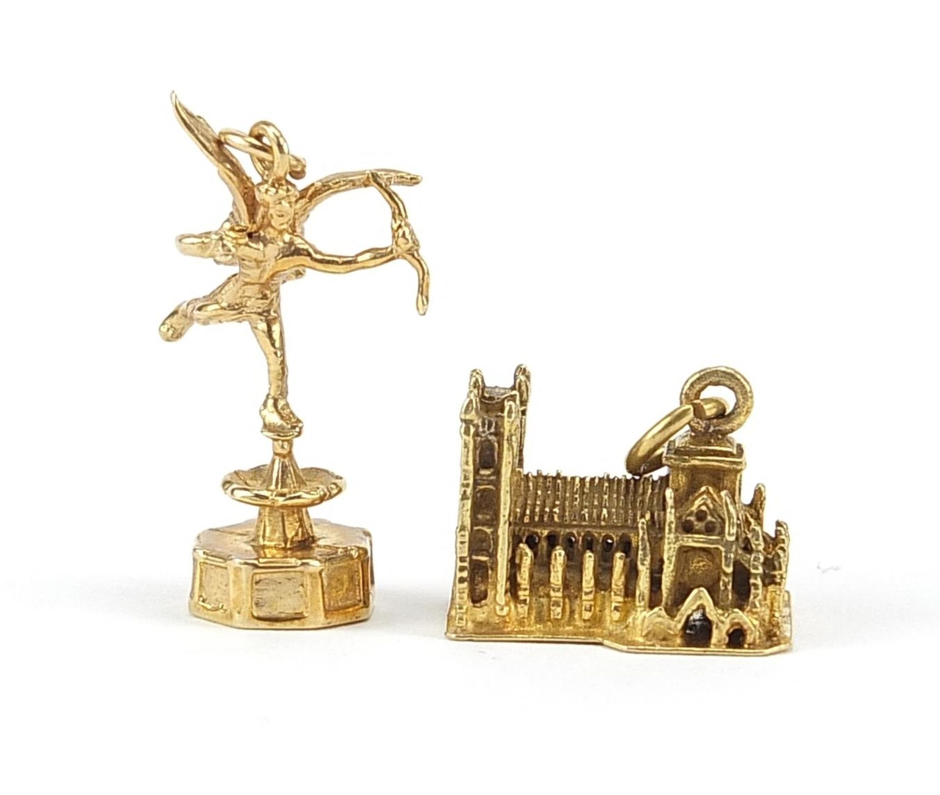 Two 9ct gold charms comprising Westminster Abbey and Eros, the largest 2.3cm high, total 10.0g