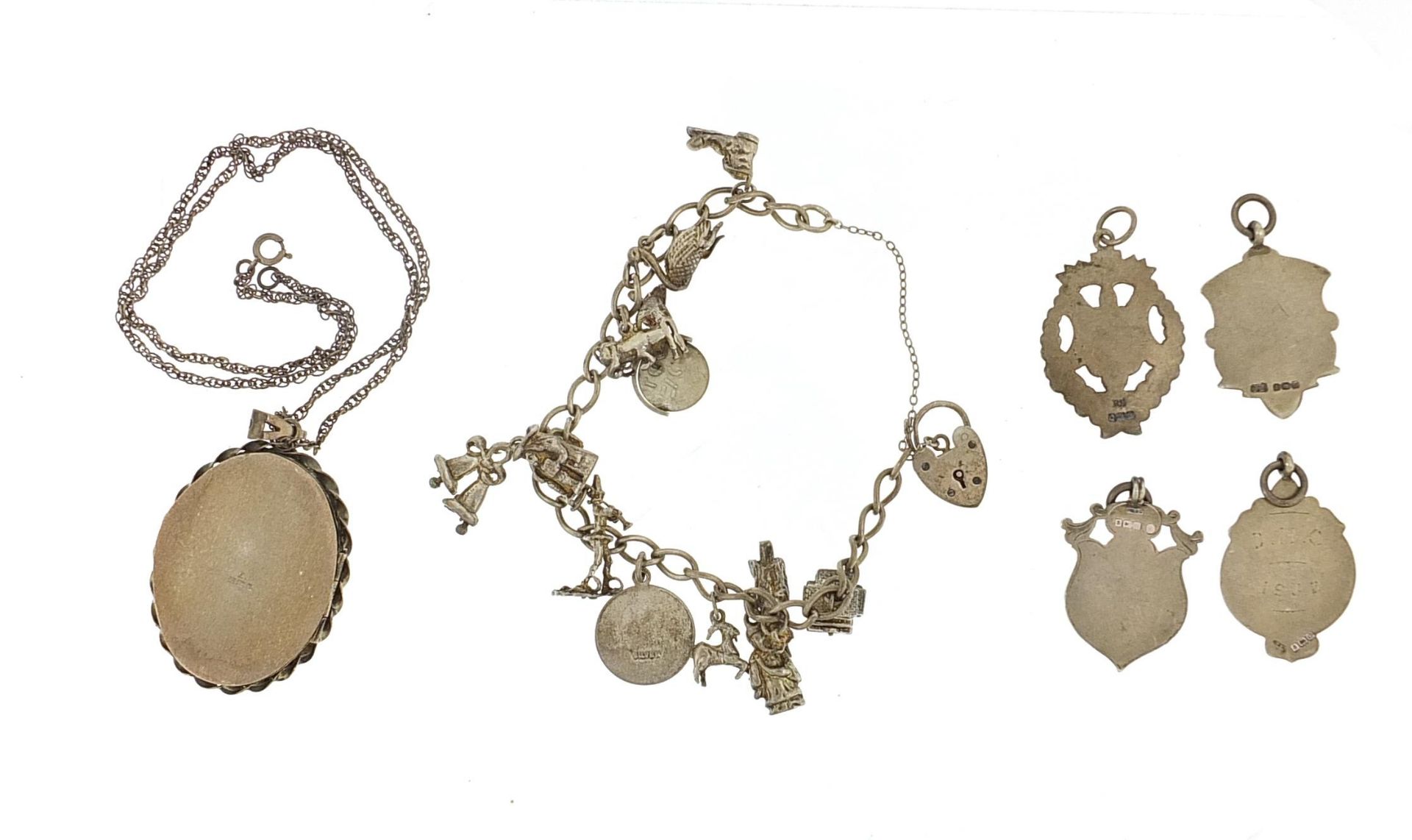 Silver jewellery comprising charm bracelet with charms, four sports jewels and large cameo locket on - Image 2 of 4