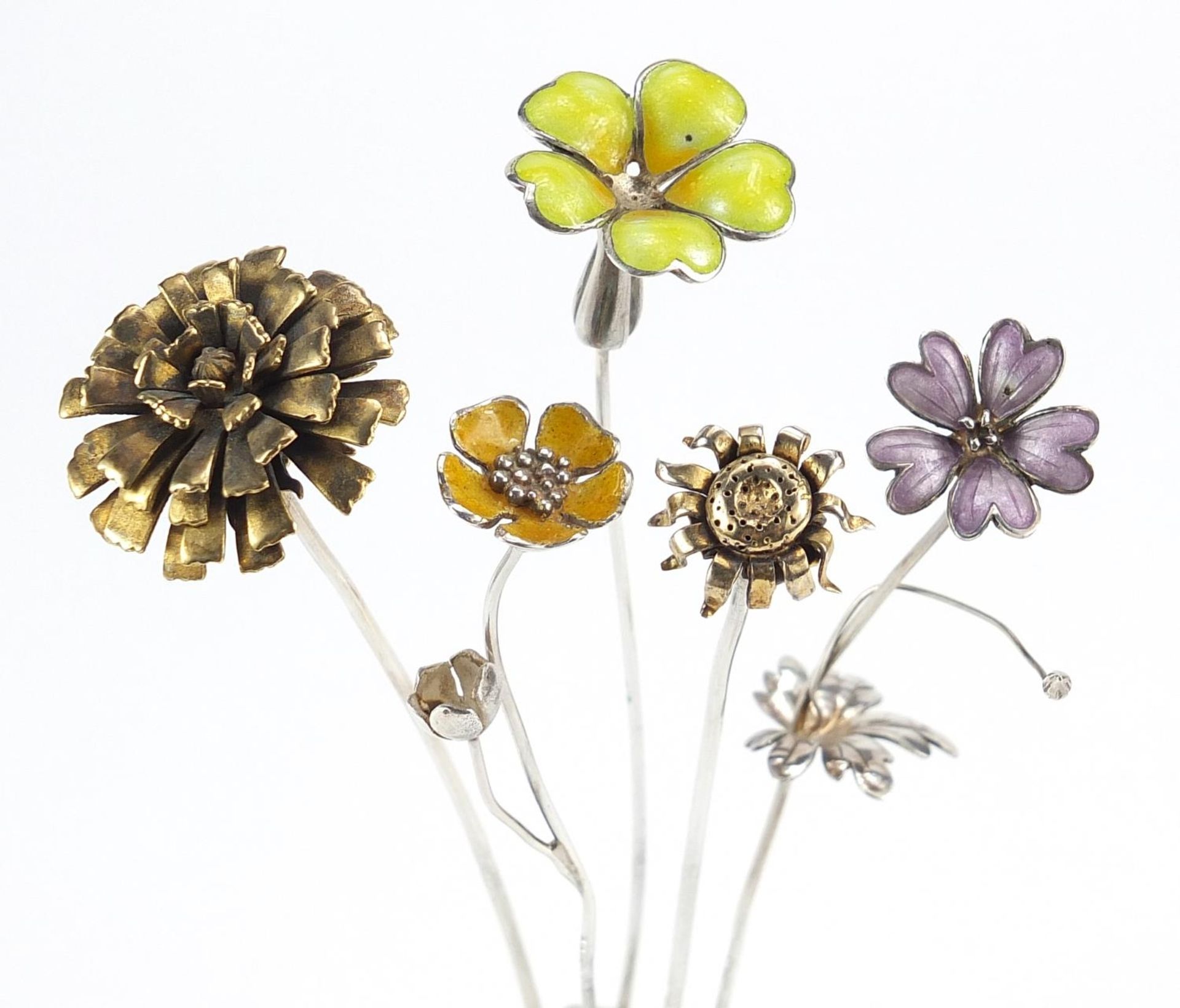 Sarah Jones, five contemporary 1980's silver flowers, three with enamel, various London hallmarks,