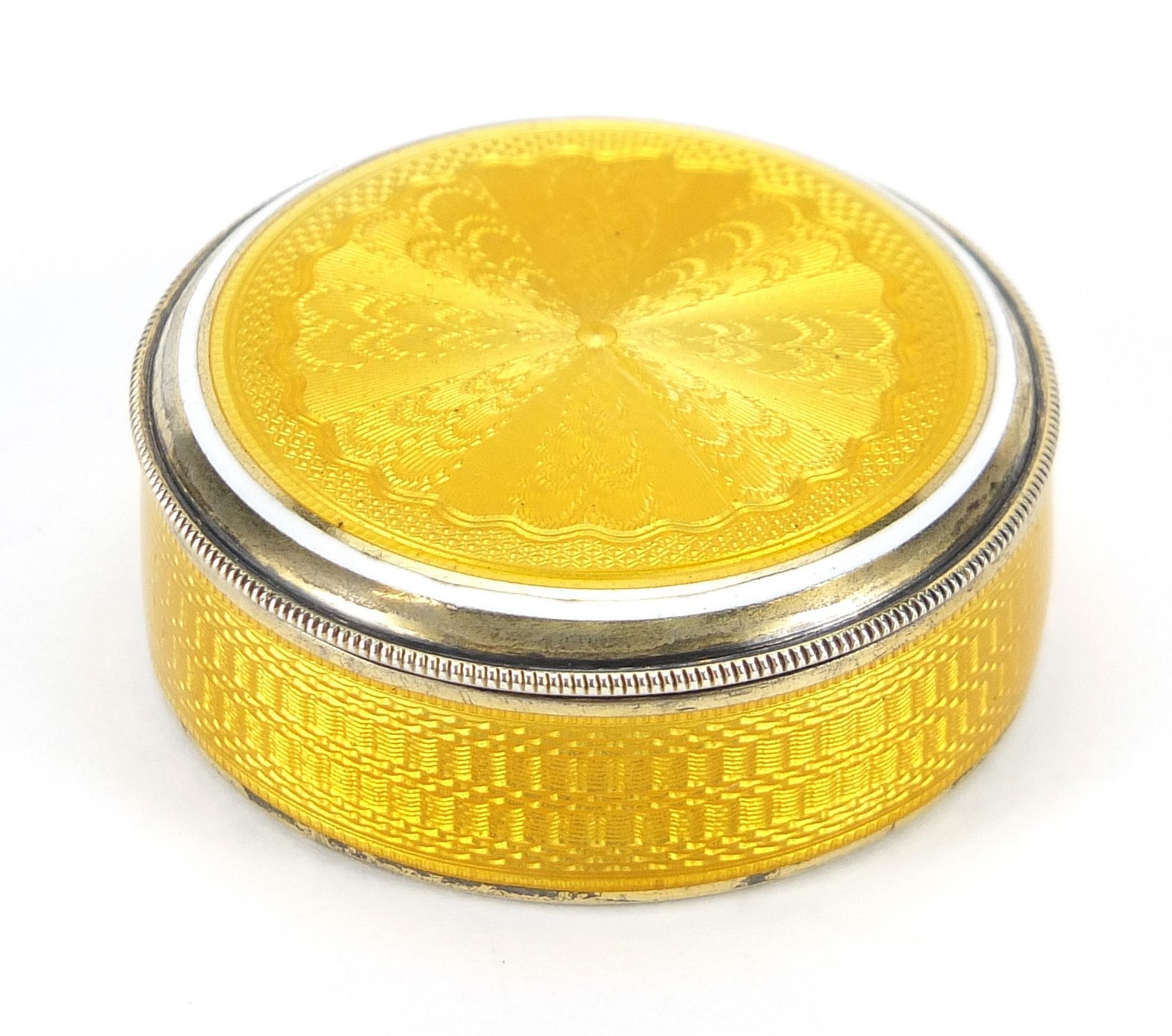 Continental 935 silver and yellow guilloche enamel pill box with hinged lid and mirrored interior,