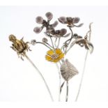 Sarah Jones, four contemporary 1980's silver flowers, two with enamel including a thistle, various