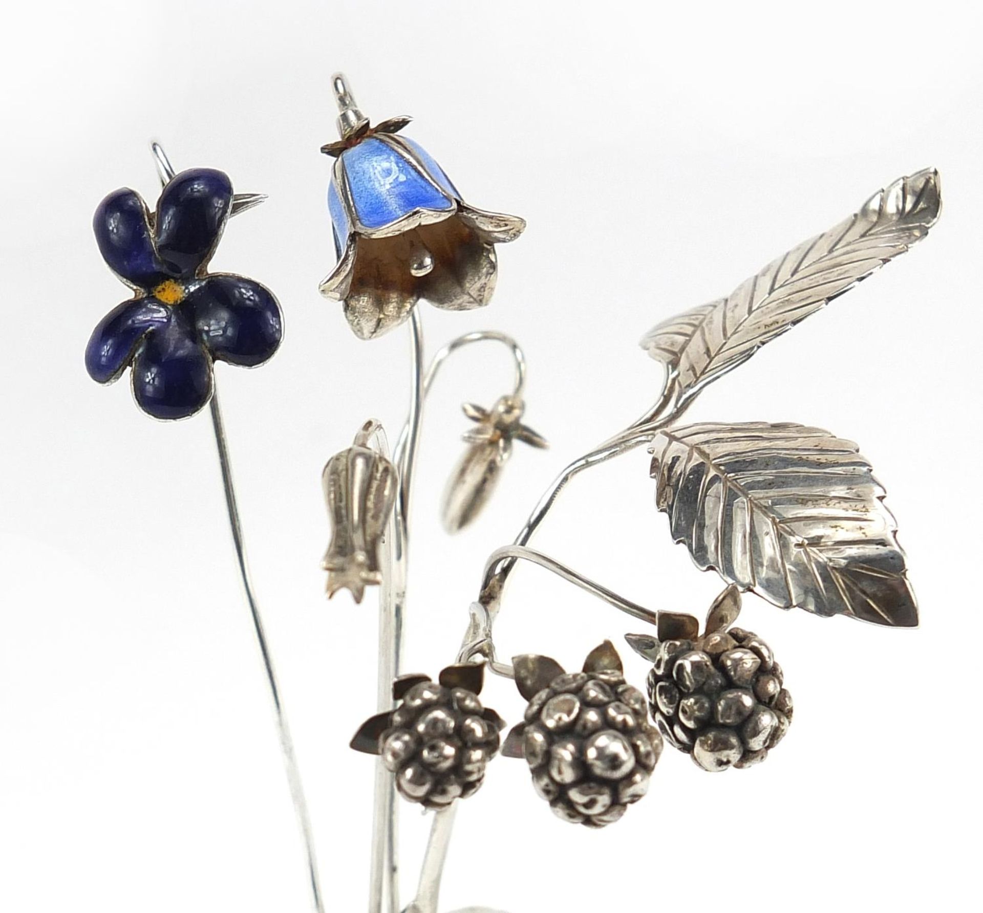 Sarah Jones, four contemporary 1980's silver flowers, two with enamel including blackberries and