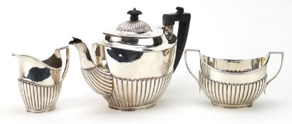 C S Harris & Sons Ltd, Edwardian matched silver three piece demi fluted tea service retailed by