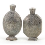 Two Persian unmarked silver scent bottles engraved with flowers and foliage, the largest 8.1cm high,