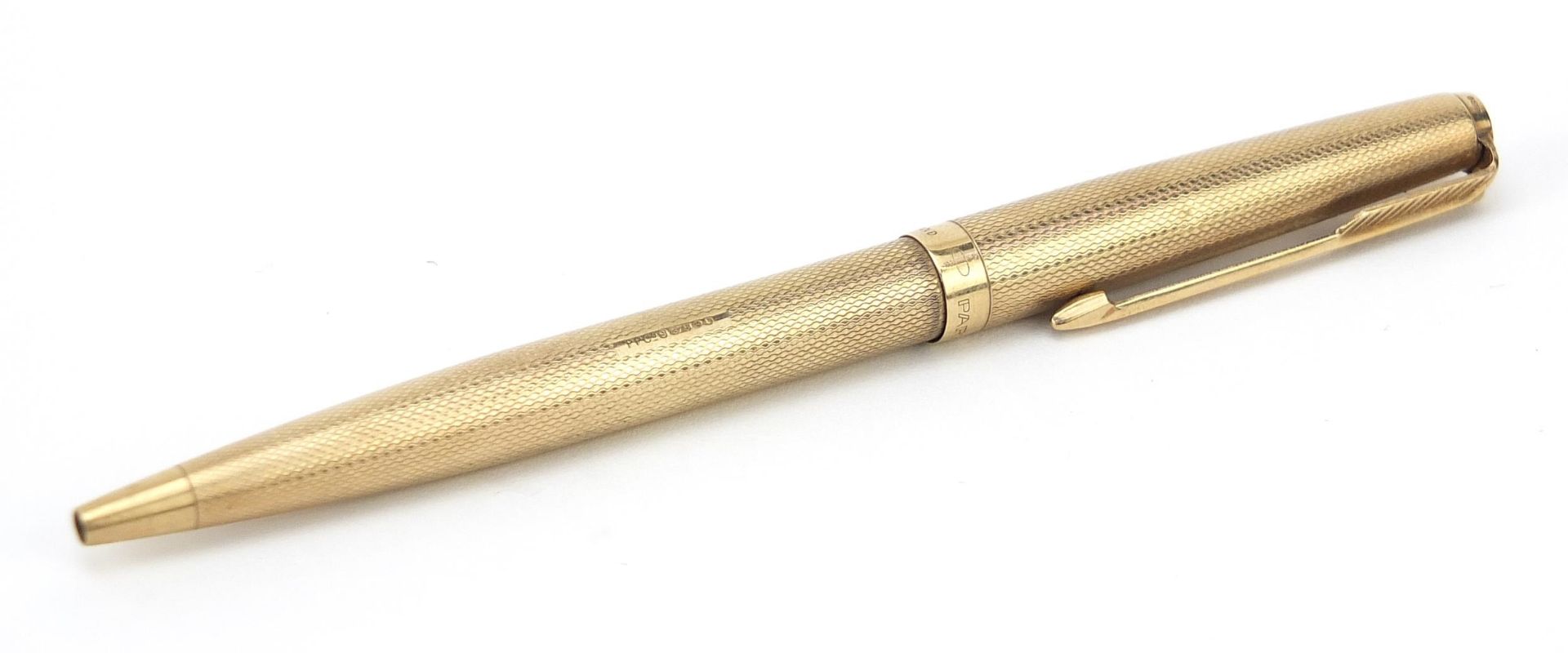 Parker, 9ct gold cased Biro pen with engine turned body, 12.8cm in length, 18.5g