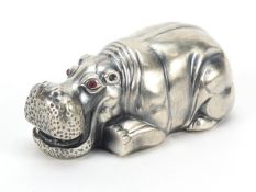 Silver hippopotamus paperweight with ruby eyes, impressed Russian marks to the base, 7.8cm in
