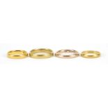 Four gold rings comprising one 22ct gold, size K, 4.0g, two 18ct gold, sizes J and Q, 7.6g and one