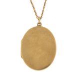 9ct gold oval locket on a 9ct necklace, 3.3cm high and 42cm in length, 8.4g - this lot is sold