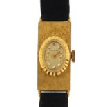 Delano, ladies 18ct gold wristwatch, the case 1.1cm wide, with black suede strap, 10.7g - this lot