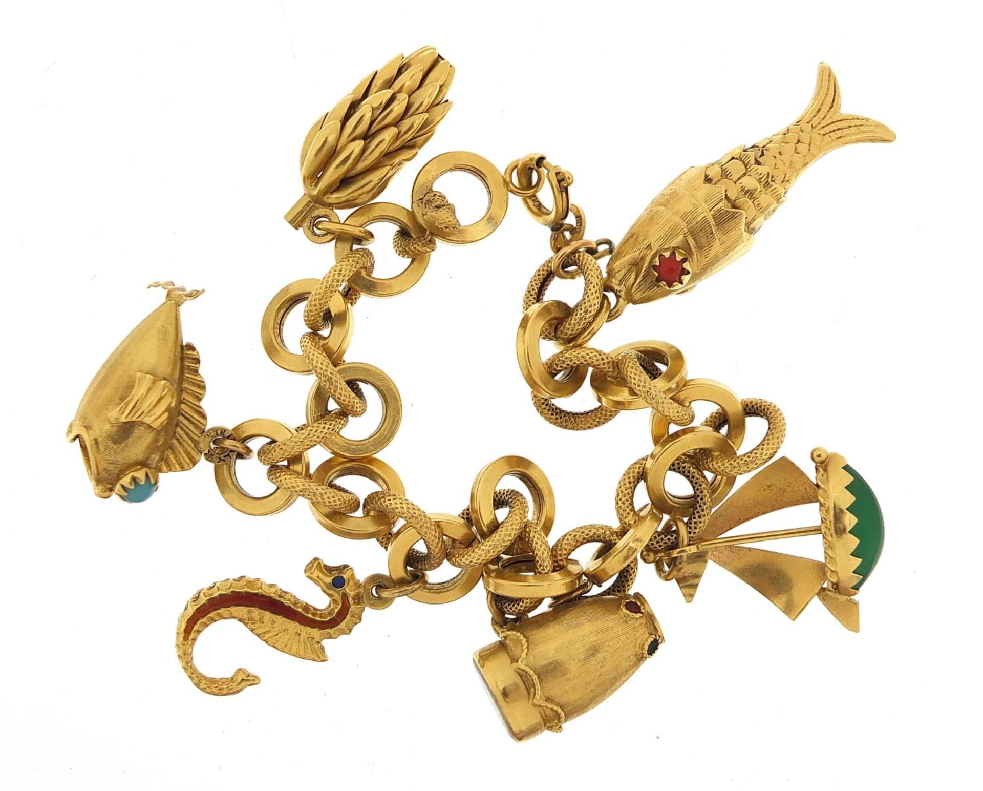 18ct gold charm bracelet with a selection of gold charms including enamelled seahorse, drum with - Image 2 of 3