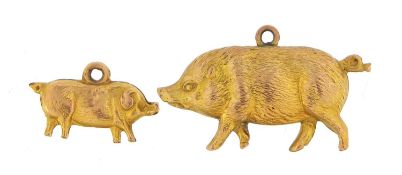Two 9ct gold pig and boar charms, the largest 3cm in length, total 2.2g - this lot is sold without