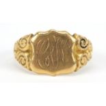 George V 18ct gold shield shaped signet ring with scrolled shoulders, Birmingham 1916, size V, 9.