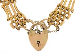 9ct gold four row gate link bracelet with love heart padlock, 16cm in length, 17.6g - this lot is