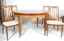 1960’S G PLAN TEAK WOOD SUITE - TEAK WOOD ROUND EXTENDING TABLE AND FOUR CHAIRS