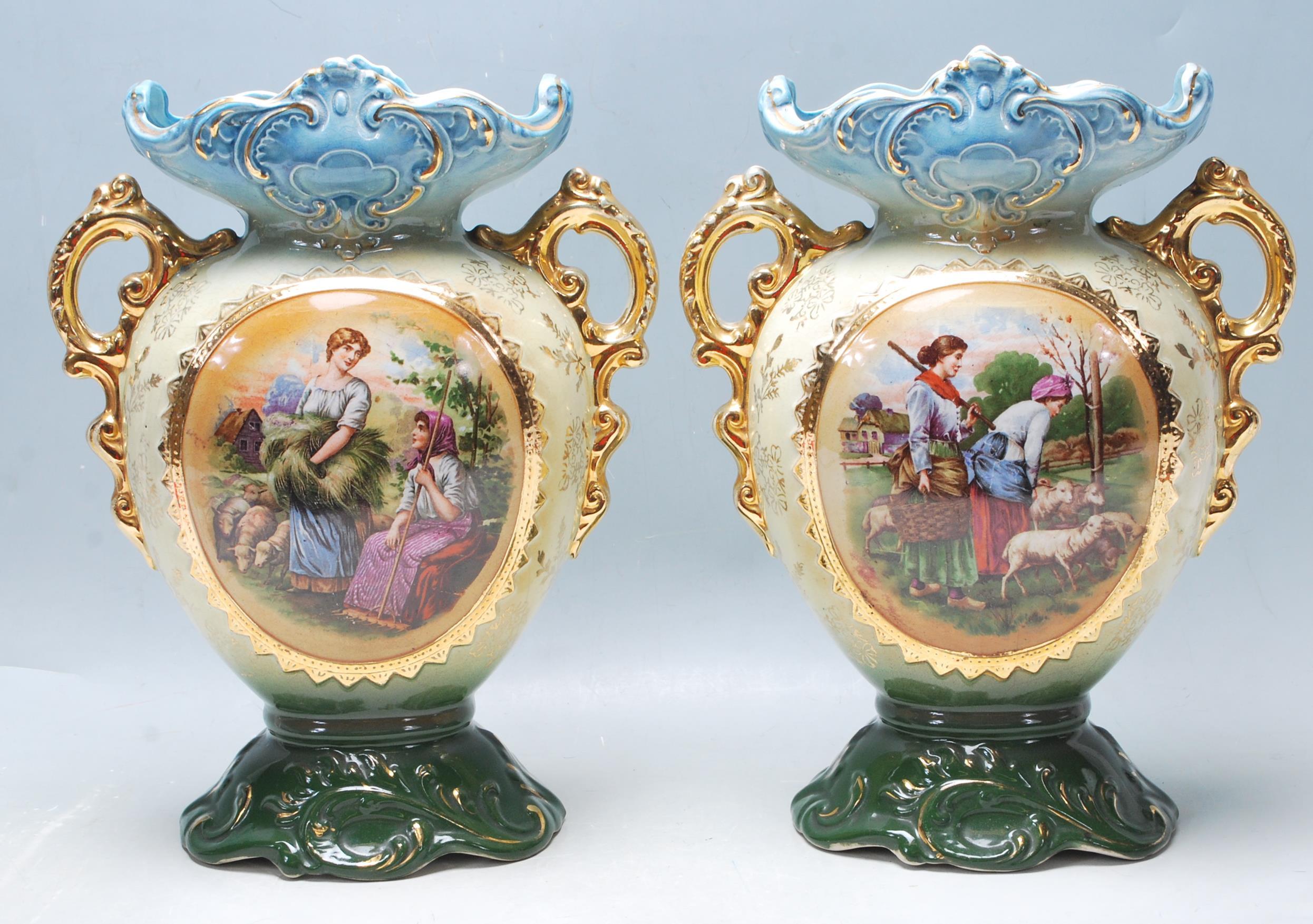 PAIR OF ANTIQUE EARLY 20TH CENTURY VASES HAVING A