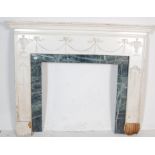 20TH CENTURY ADAMS REVIVAL FIRE PLACE SURROUND WITH GREEN MARBLE BACKGROUND