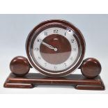 A METAMEC ART DECO 1950S OAK CASED MANTEL CLOCK WITH BAKELITE CASE