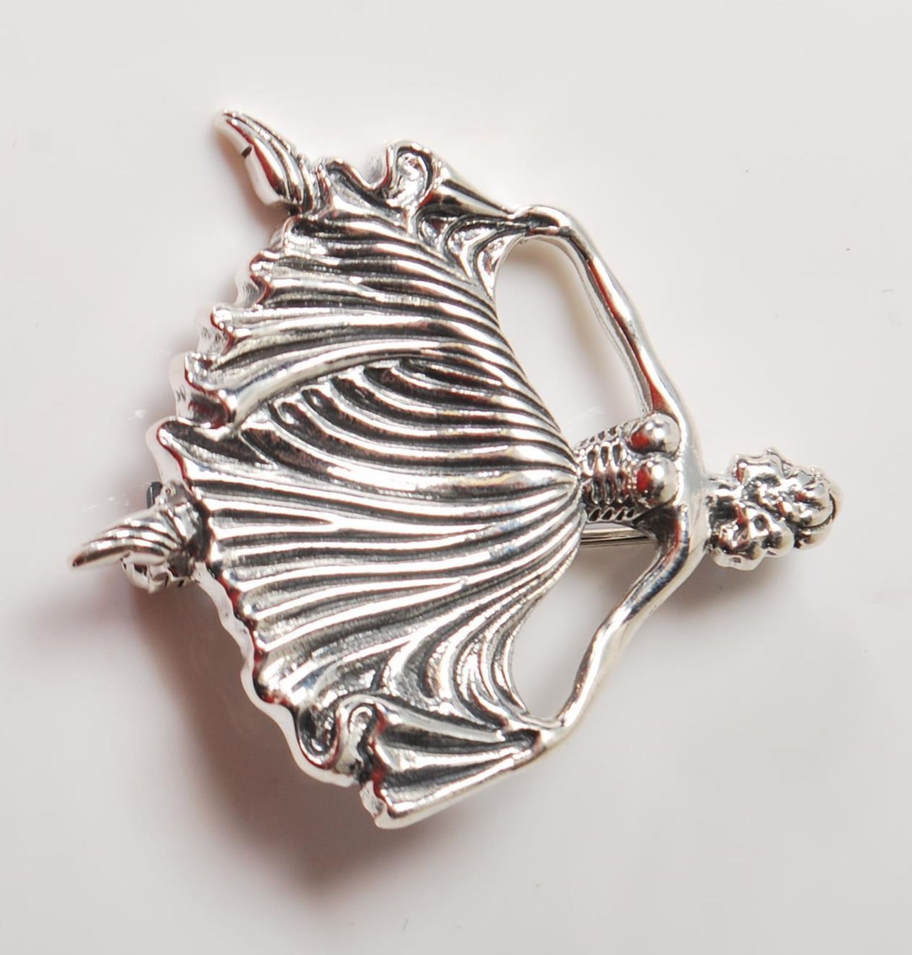 A SILVER BALLROOM DANCER BROOCH