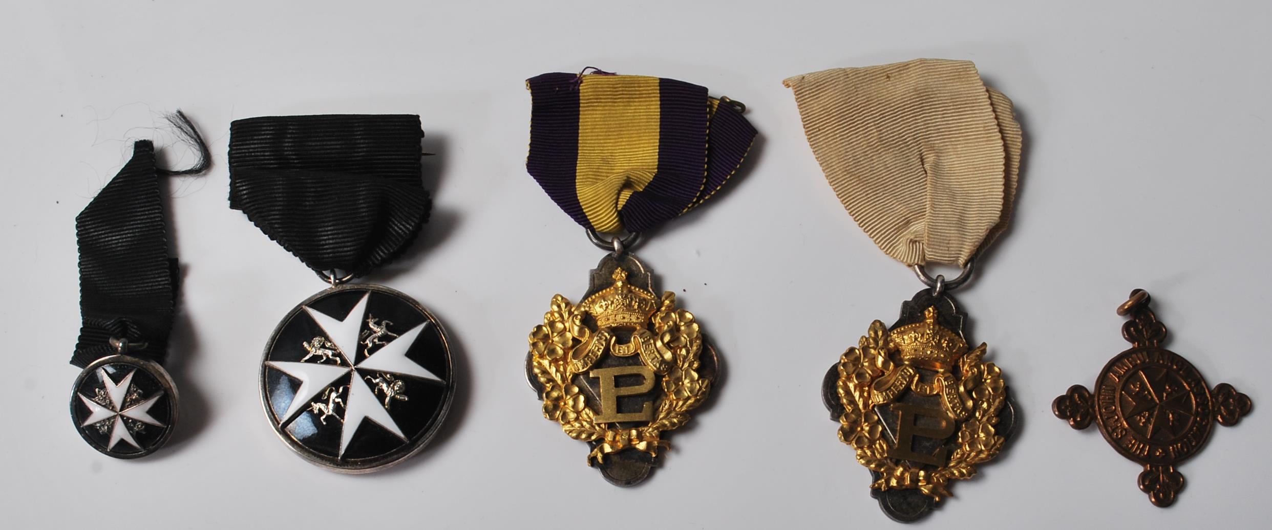 FIVE 20TH CENTURY MEDALS AND BADGES