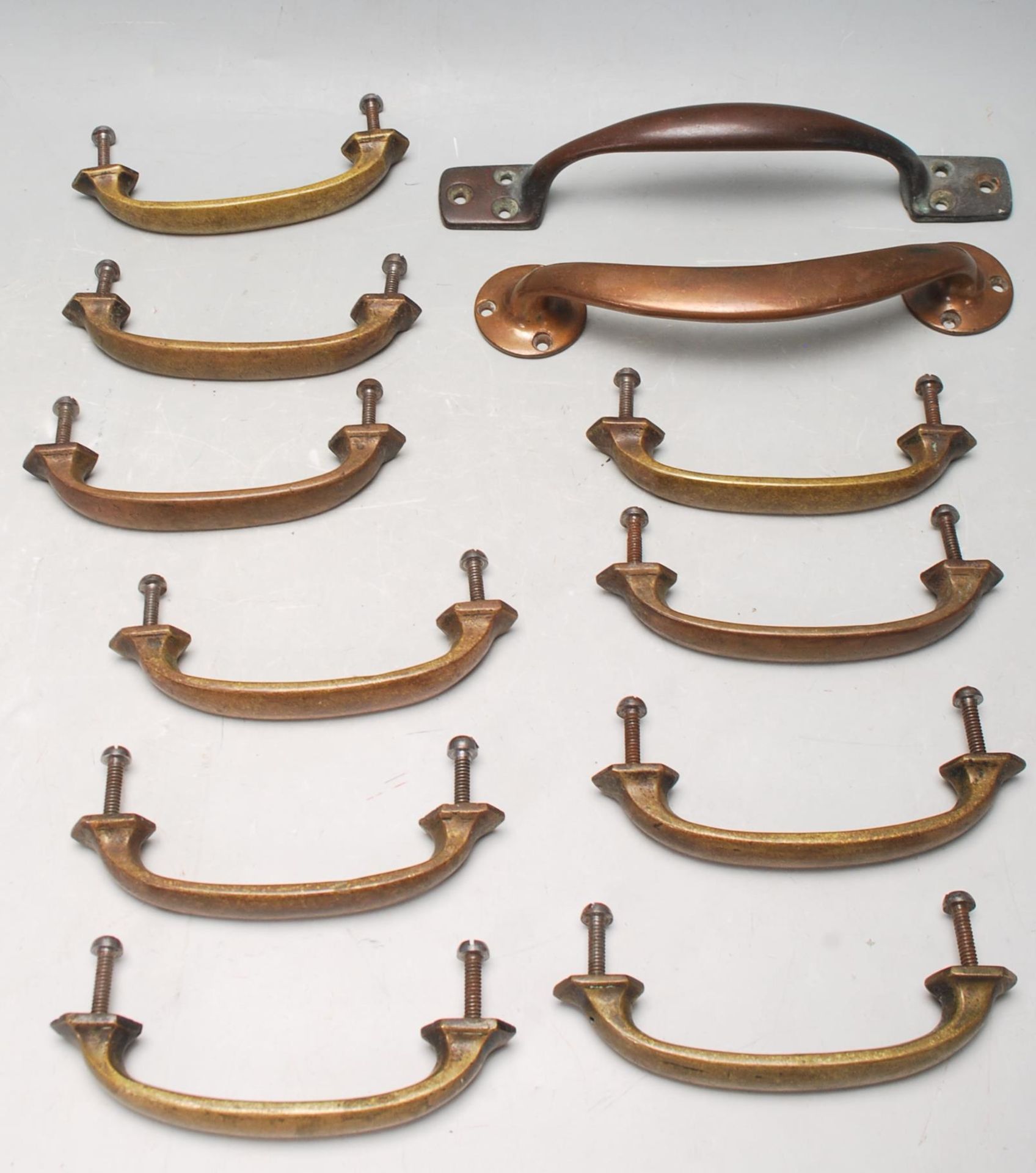 FIVE PAIRS OF EARLY 20TH CENTURY BRASS DOOR / CHEST OF DRAWER HANDLES
