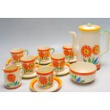 FIFTEEN PIECE ART DECO 1930’S TEA SET DECORATED WITH ORANGE FLOWERS