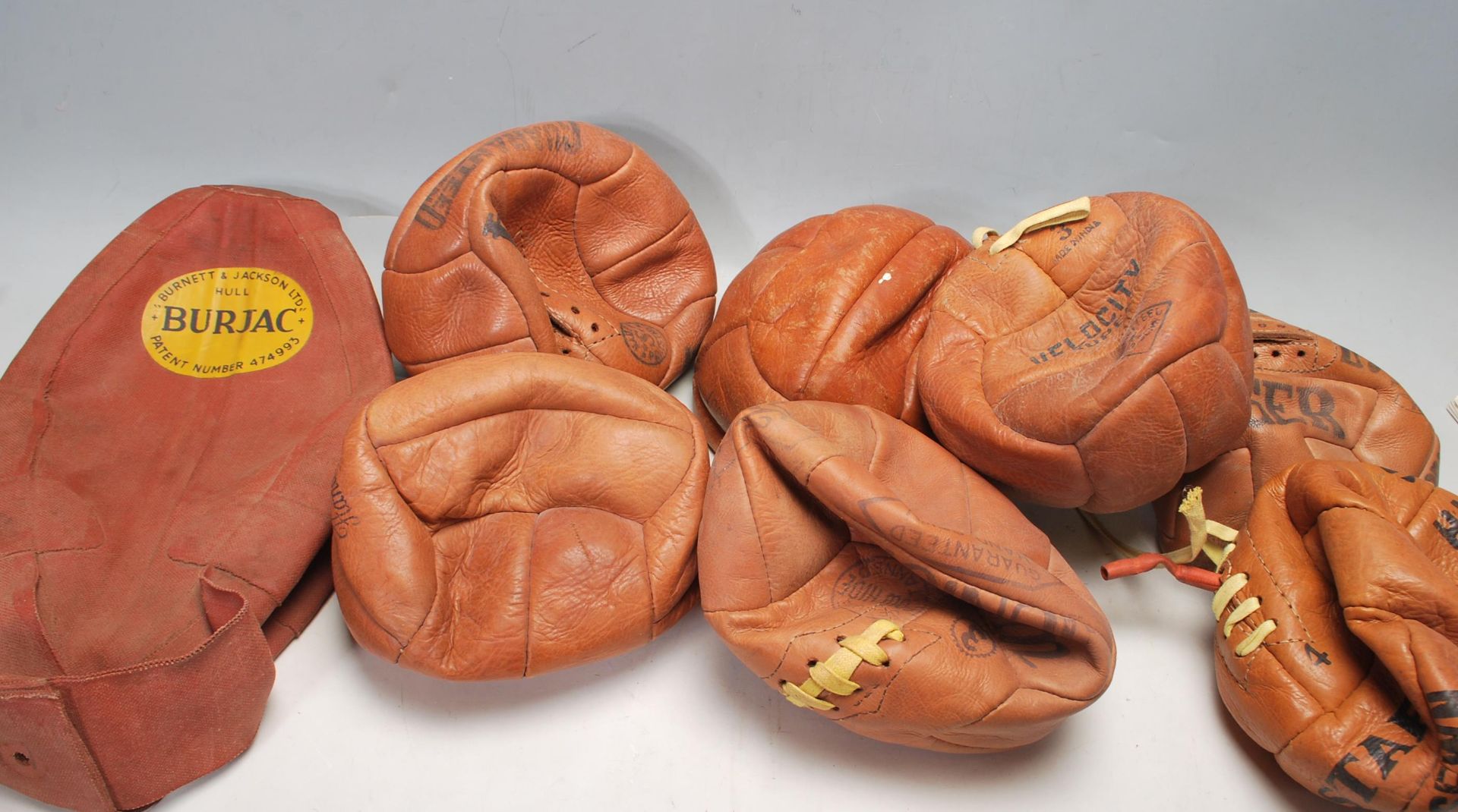 COLLECTION OF EARLY LEATHER FOOTBALLS STAR - TIGER ETC