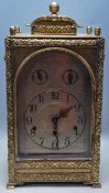 ANTIQUE LATE 19TH CENTURY BRASS CASED CLOCK WITH GOTHIC STYLING