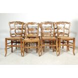 SET OF EIGHT MID 20TH CENTURY FRENCH OAK DINING CHAIRS