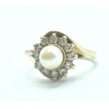 9CT GOLD PEARL AND WHITE STONE CROSSOVER RING