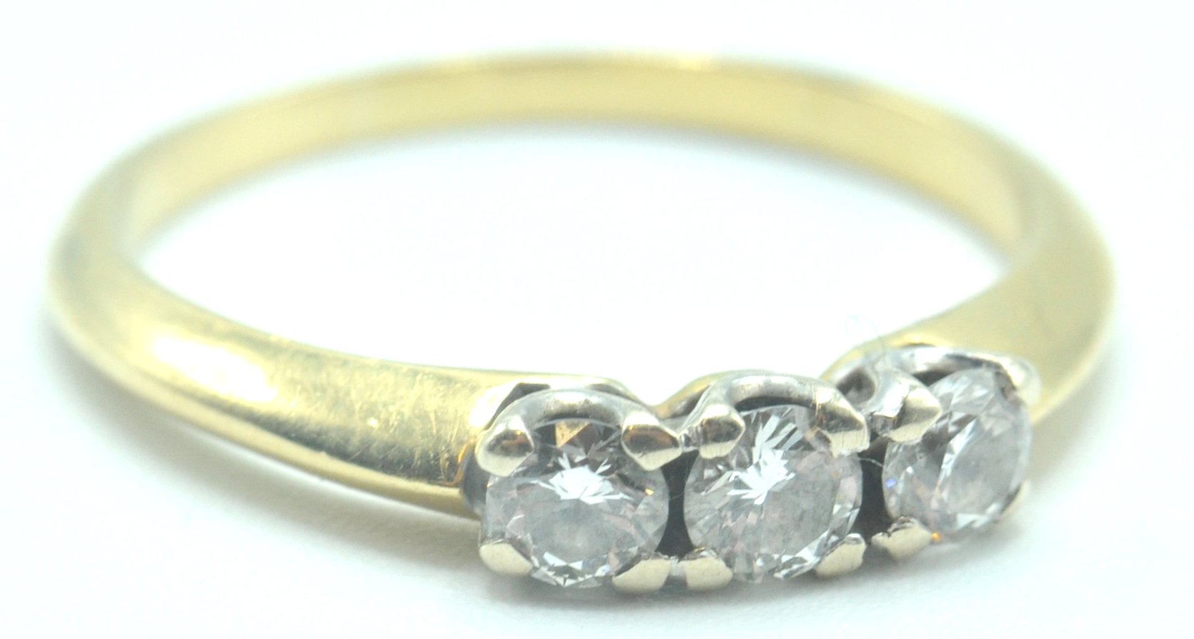 CONTEMPORARY 18CT GOLD AND DIAMOND THREE STONE RING