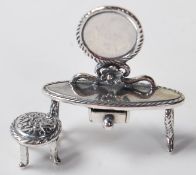 SILVER DRESSING TABLE FIGURINE
