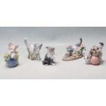 A COLLECTION OF LLADRO FIGURINES IN THE FORM OF CATS PLAYING.