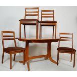 A VINTAGE 20TH CENTURY NATHAN TEAK WOOD OVAL DINING TABLE AND FOUR CHAIRS